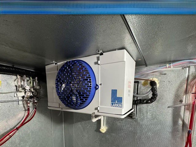 Technician repairing a commercial keg chiller