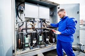 Technician repairing a commercial reefer unit