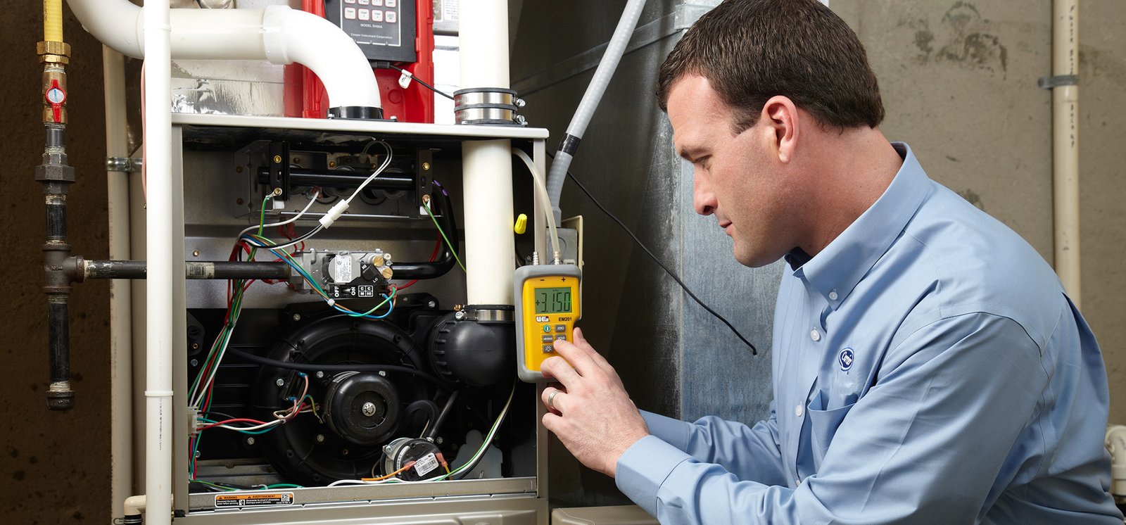 Technician repairing a furnace